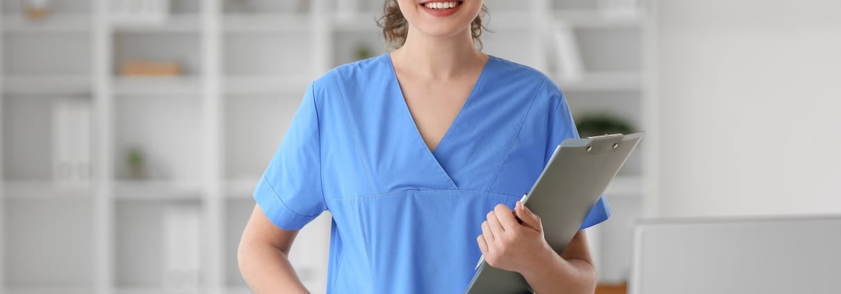 Medical Assistant with a clipboard at a clinic