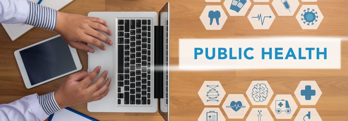 Overhead view of healthcare symbols and letters that say public health