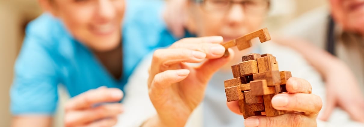 Close up of an elderly woman in an occupational therapy session